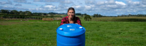 Leah pushing over a barrel of bloat oil because she is bored of bloat oil